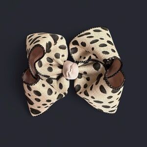 beige and black animal print smocked bow